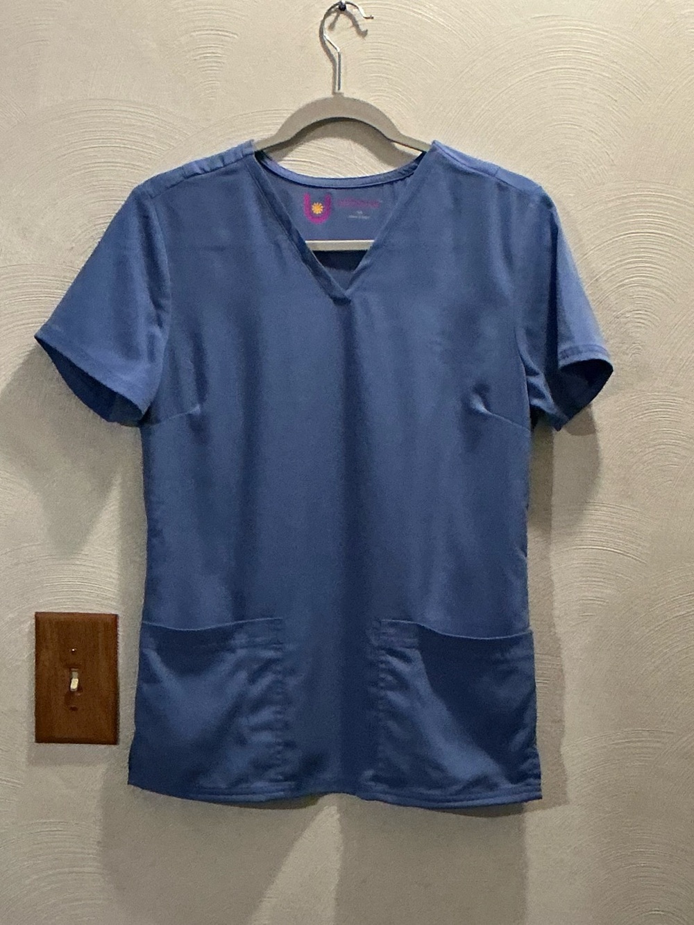 Urbane Blue V-Neck Medical Scrub Top. Size Small. Two front slip-in pockets.